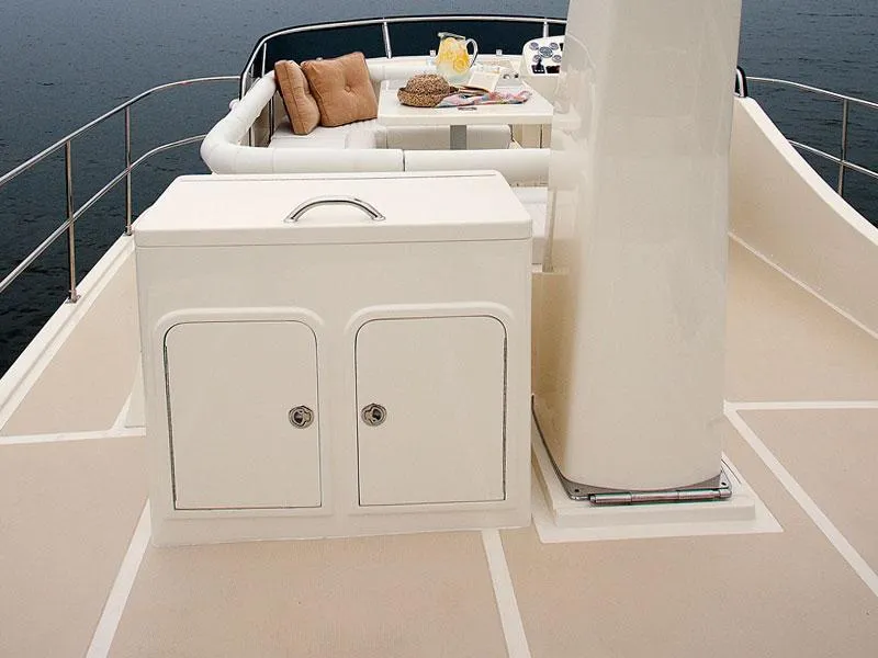 Slide: The Image of Helmsman Trawlers 38 Sedan 2026 yacht deck with seating and storage. - 41