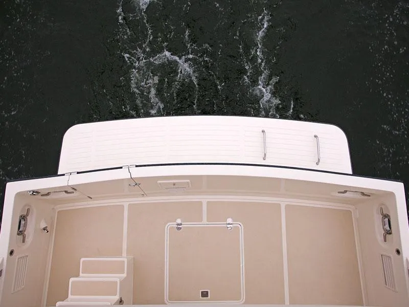 Slide: The Image of Helmsman Trawlers 38 Sedan 2026, view of deck and water from above. - 43