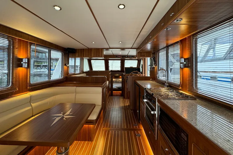 Slide: The Image of Luxurious interior of 2026 Helmsman Trawlers 38 Sedan with wood finishes and modern amenities. - 7