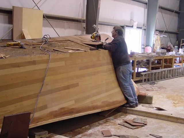 Slide: The Image of Man working on 1956 Emancipator cruiser in a workshop. - 13