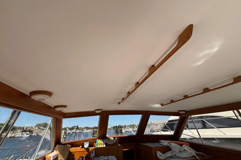 Slide: The Image of Interior view of 1985 Egg Harbor 37 Tournament boat with wooden accents and large windows. - 17
