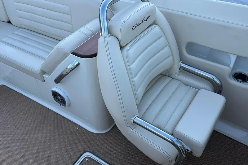 Slide: The Image of Luxurious interior seating of 2013 Chris-Craft Corsair 25 boat with white leather upholstery. - 16