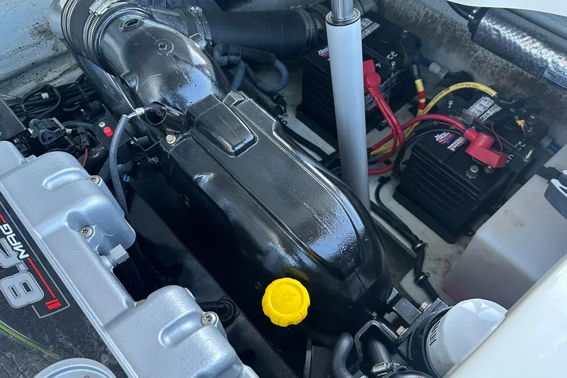 Slide: The Image of Engine compartment of 2013 Chris-Craft Corsair 25 with visible components and wiring. - 20