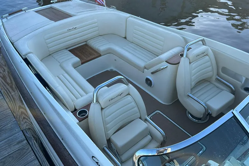 Slide: The Image of 2013 Chris-Craft Corsair 25 boat interior with luxurious cream leather seating. - 6
