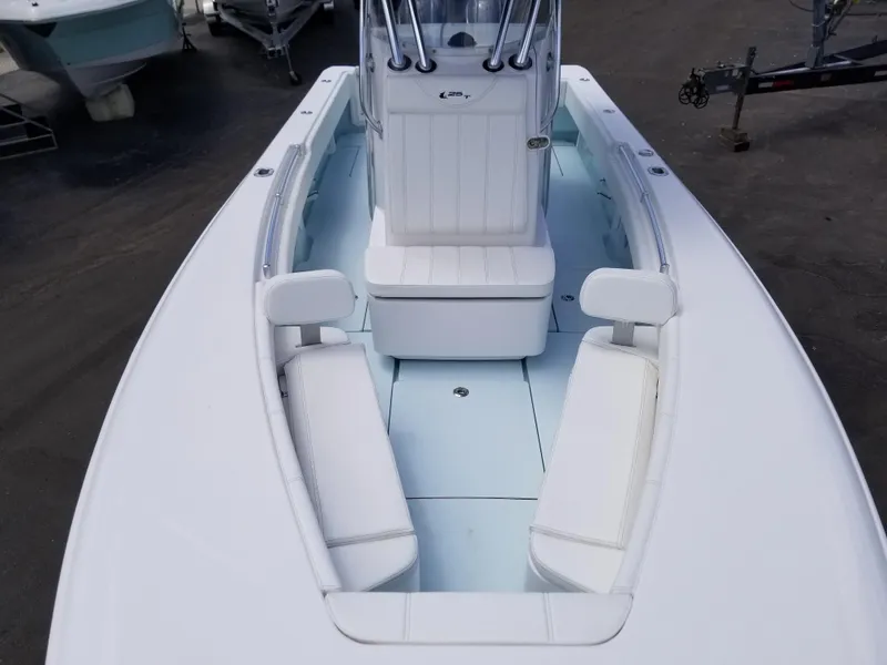 Slide: The Image of 2024 Contender 25 Tournament boat with white seating and center console. - 10