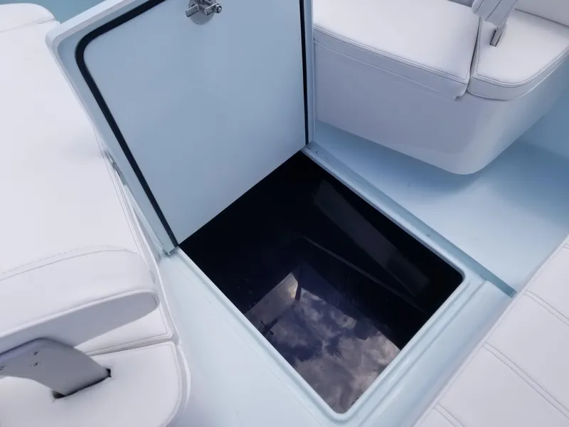 Slide: The Image of Open storage compartment on 2024 Contender 25 Tournament boat. - 12