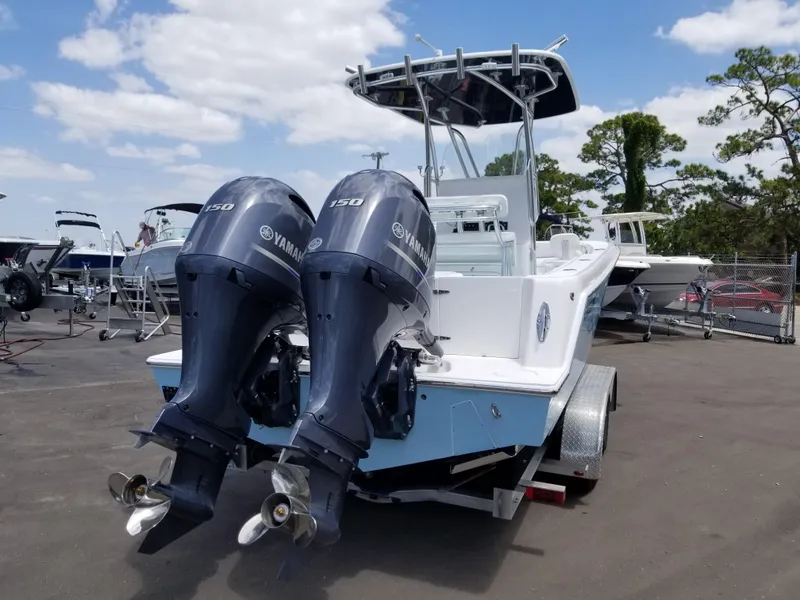 Slide: The Image of 2024 Contender 25 Tournament boat with twin Yamaha 150 engines on trailer. - 4