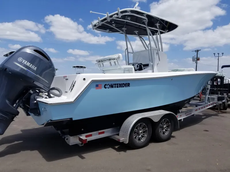 Slide: The Image of 2024 Contender 25 Tournament boat on trailer with Yamaha outboard motor. - 5