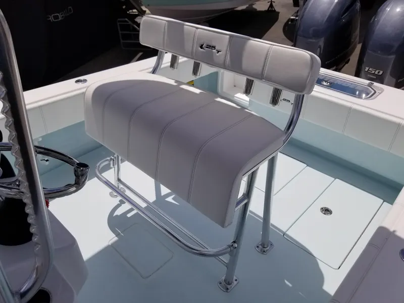 Slide: The Image of 2024 Contender 25 Tournament boat with dual outboard engines and cushioned seating. - 7