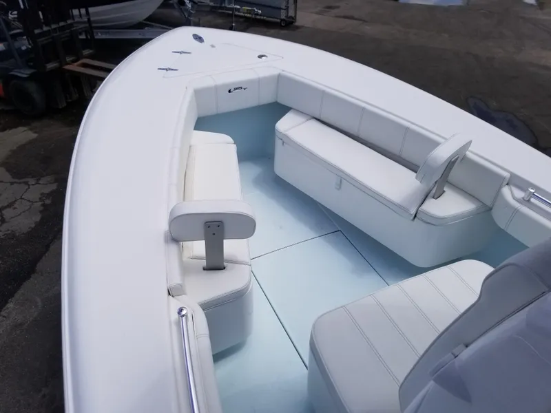Slide: The Image of 2024 Contender 25 Tournament boat interior with white cushioned seating. - 9