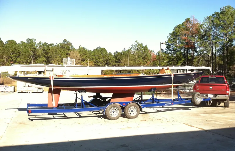 Slide: The Image of 2026 C.W. Hood 32 Daysailer on trailer, parked outdoors near trees. - 10