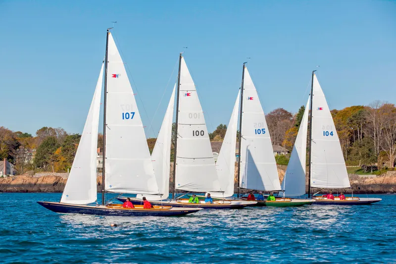 Slide: The Image of Four C.W. Hood 32 Daysailers racing on a sunny day, 2026 model. - 5
