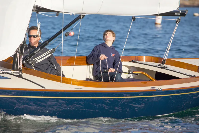 Slide: The Image of Two people sailing a 2026 C.W. Hood 32 Daysailer on calm waters. - 8
