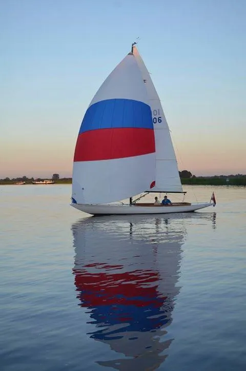 Slide: The Image of Sailing on calm waters, 2026 C.W. Hood 32 Daysailer with colorful spinnaker. - 9