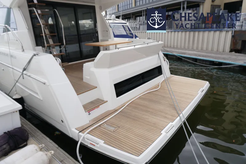 Slide: The Image of Prestige 460 Flybridge 2025 yacht docked at Chesapeake Yacht Center. - 17