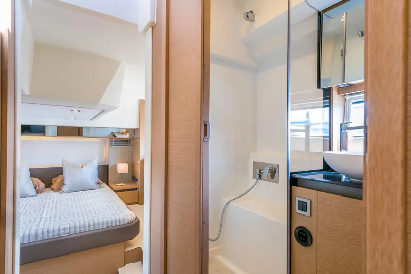 Slide: The Image of Interior of 2025 Prestige 460 Flybridge yacht featuring bedroom and bathroom. - 7