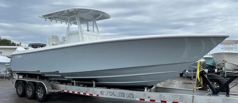 Slide: The Image of 2024 Contender 32 ST boat on a trailer, side view. - 0