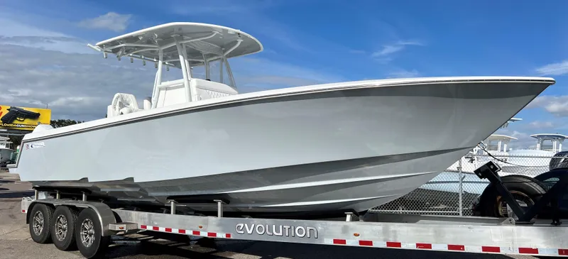 Slide: The Image of 2024 Contender 32 ST boat on Evolution trailer, side view. - 1