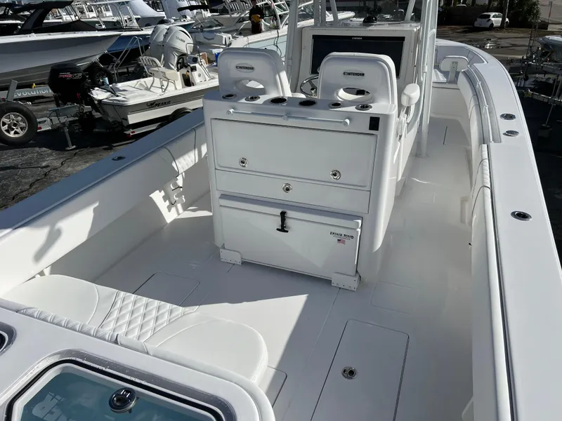 Slide: The Image of 2024 Contender 32 ST boat interior with seating and storage compartments. - 7