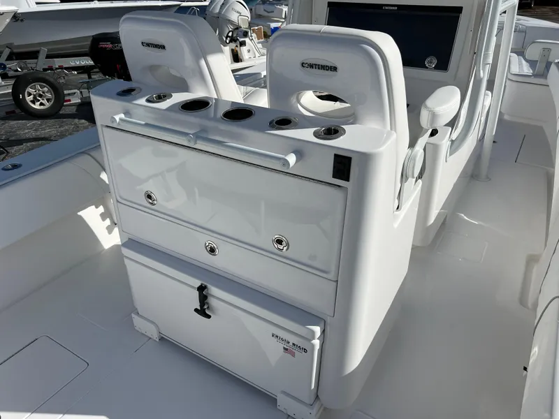 Slide: The Image of 2024 Contender 32 ST boat interior with seating and storage compartments. - 8