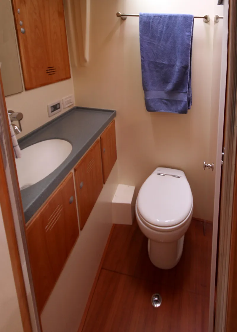 Slide: The Image of 2026 Lyman Morse Farr Racer-Cruiser bathroom with wooden cabinetry and modern fixtures. - 15