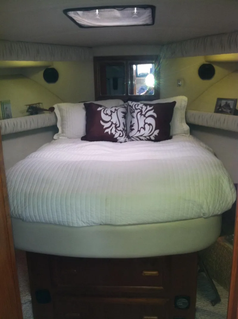 Slide: The Image of Cozy bedroom interior of 1989 Californian 48 Motor Yacht with elegant bedding. - 20