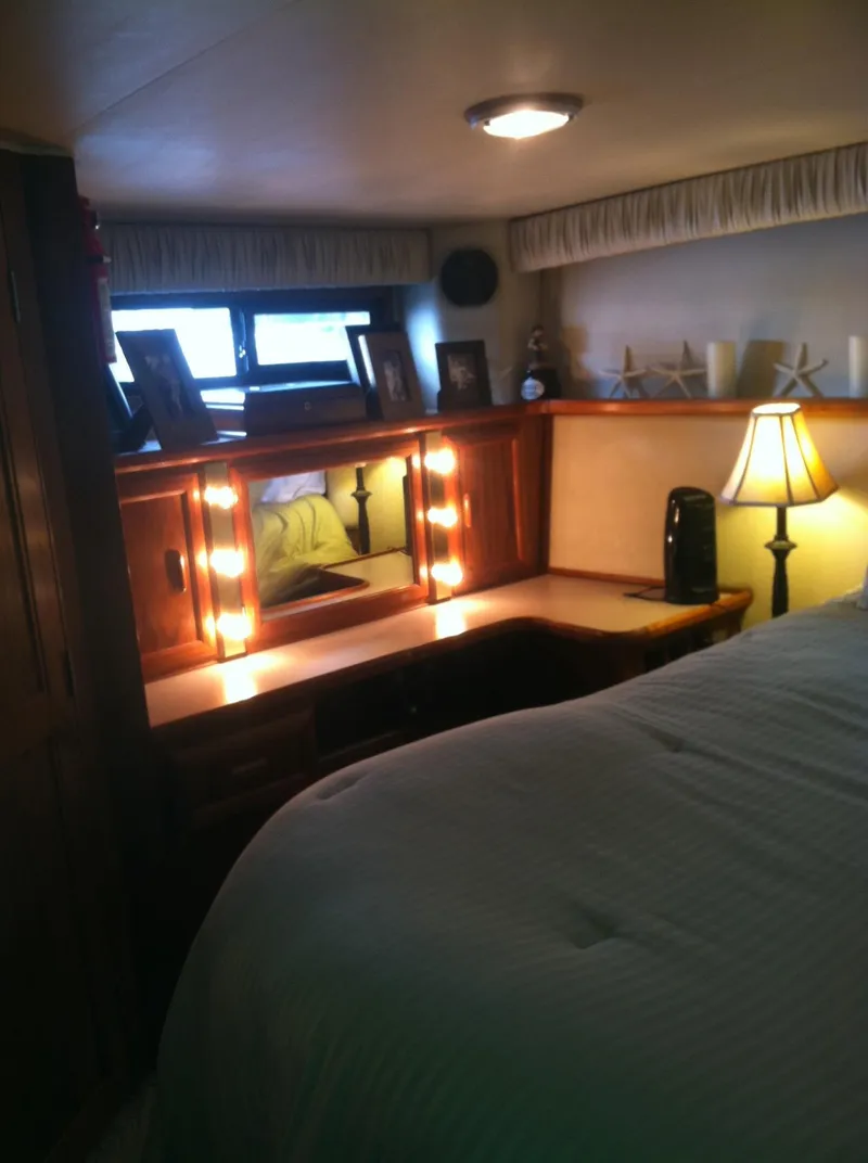 Slide: The Image of Cozy interior of 1989 Californian 48 Motor Yacht with vanity and ambient lighting. - 31