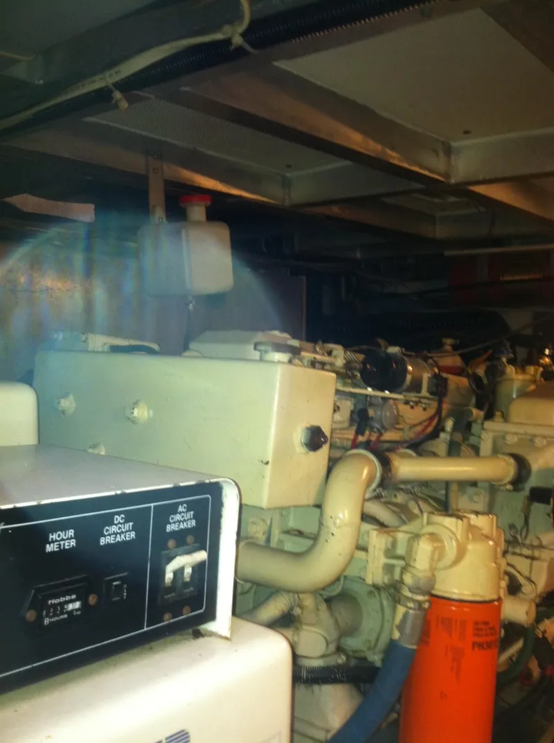 Slide: The Image of Engine room of 1989 Californian 48 Motor Yacht with visible machinery and controls. - 42