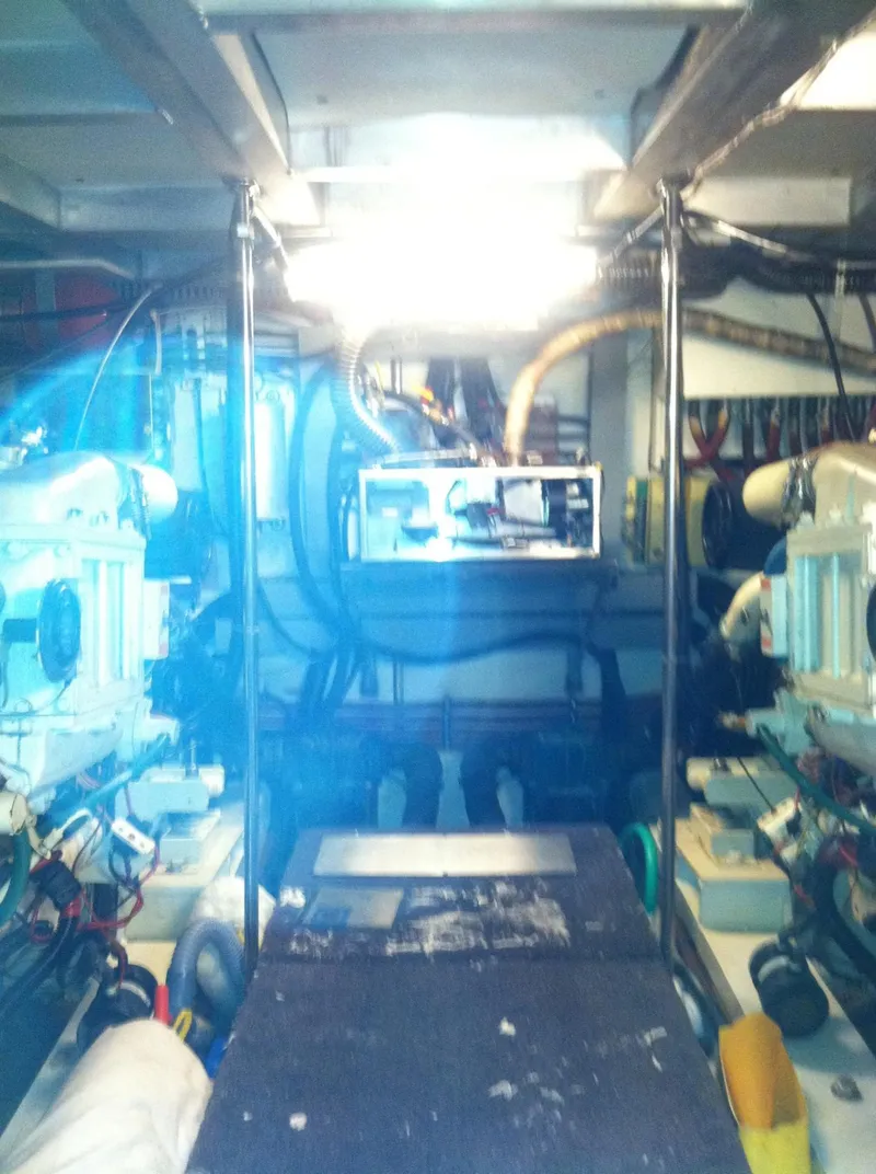 Slide: The Image of Engine room of 1989 Californian 48 Motor Yacht, showcasing machinery and equipment. - 43