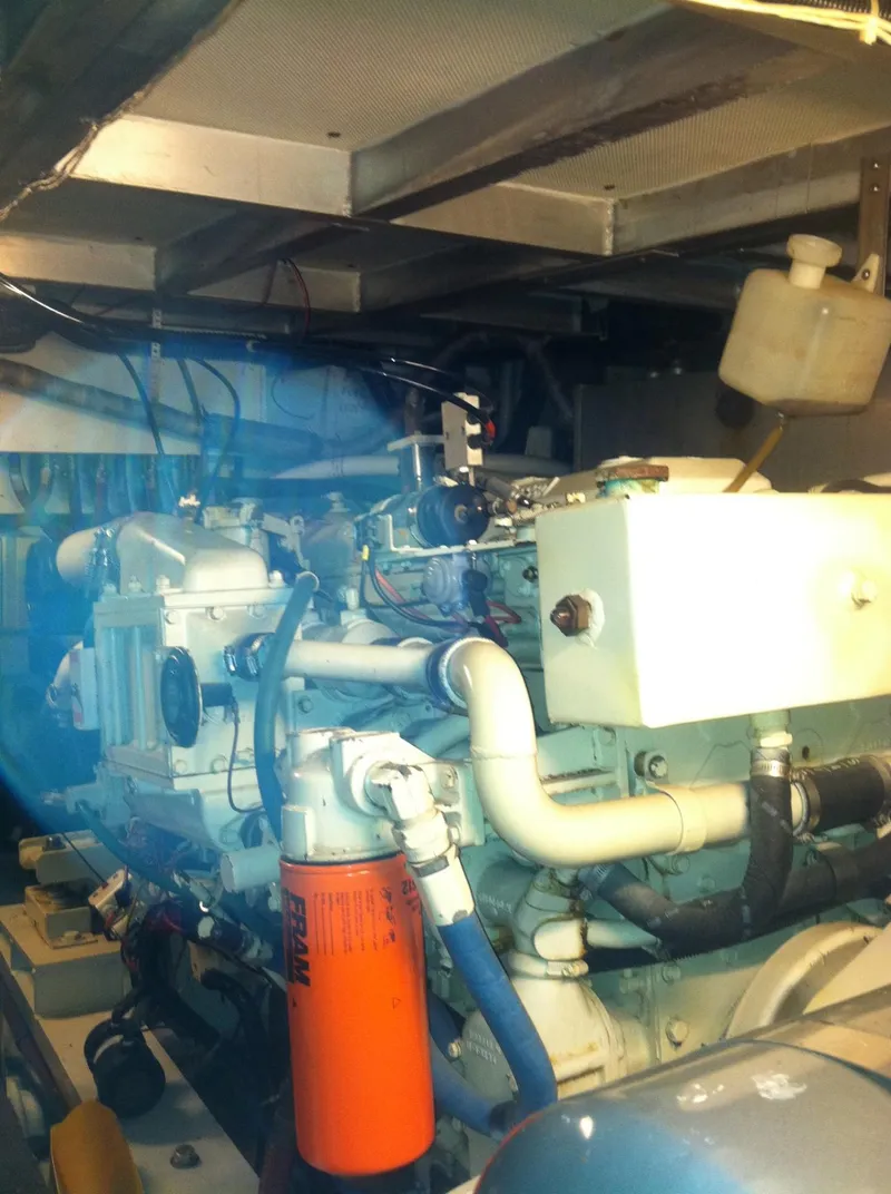 Slide: The Image of Engine room of 1989 Californian 48 Motor Yacht, showcasing mechanical components and systems. - 44