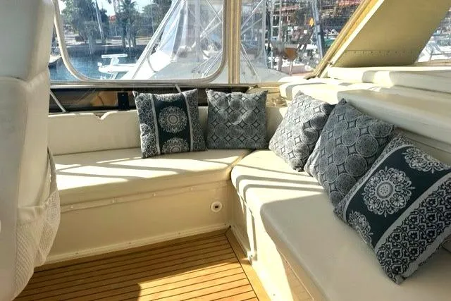 Slide: The Image of Luxurious seating area on 1989 Californian 48 Motor Yacht with decorative cushions. - 46