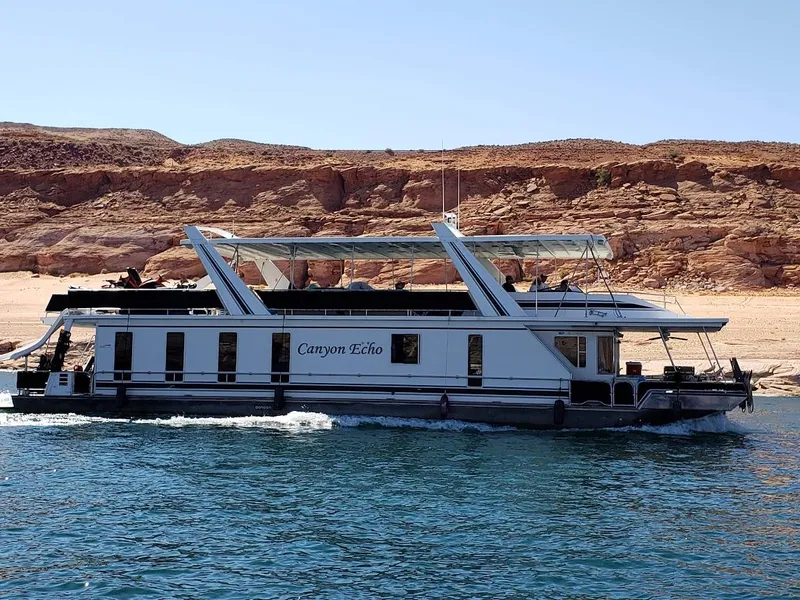 Slide: The Image of 2005 Stardust Cruisers Multi Owner Houseboat on a scenic lake. - 14