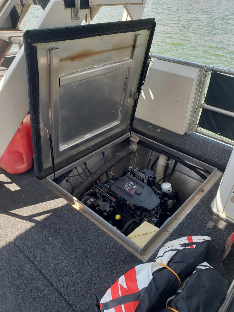 Slide: The Image of 2005 Stardust Cruisers Multi Owner Houseboat engine compartment with open hatch. - 16