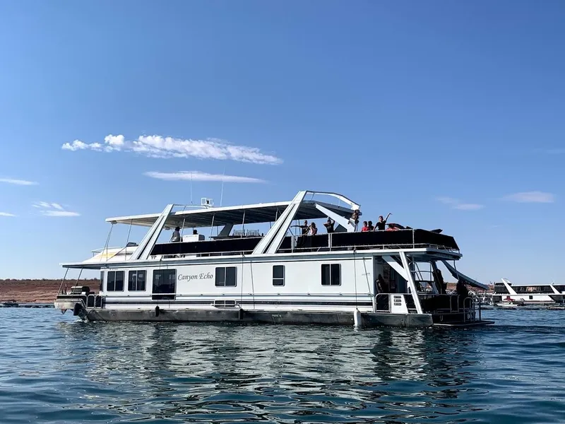 Slide: The Image of 2005 Stardust Cruisers Multi Owner Houseboat on a sunny day on the water. - 6