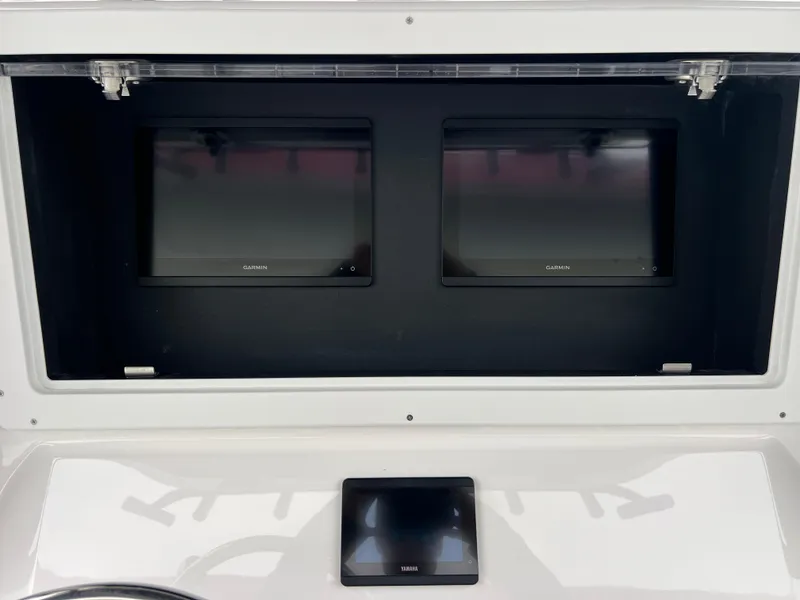 Slide: The Image of Dashboard of 2025 Contender 28S boat with dual Garmin displays. - 10