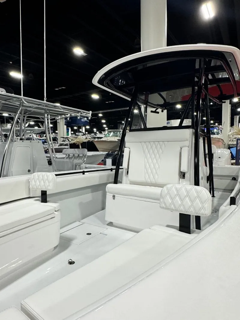 Slide: The Image of 2025 Contender 28S boat interior with white seating and modern design. - 12