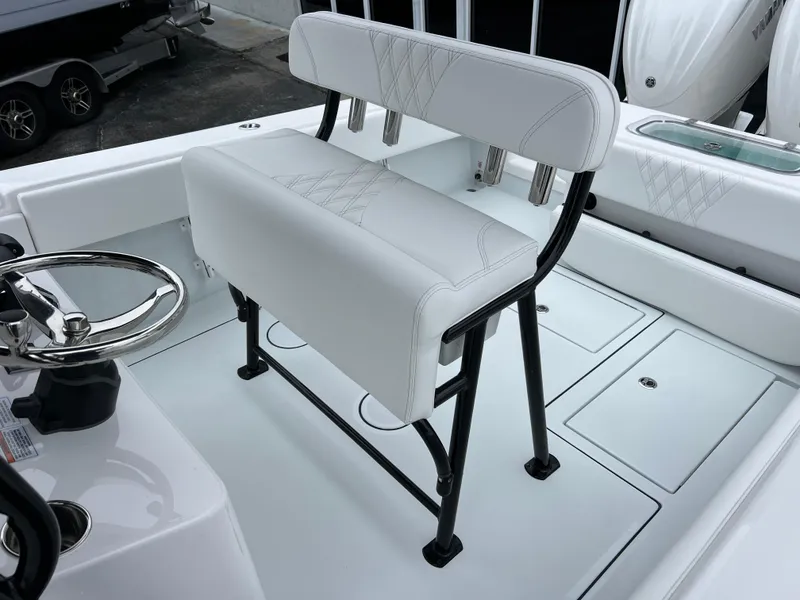 Slide: The Image of Contender 28S 2025 boat interior with white seating and steering wheel. - 13