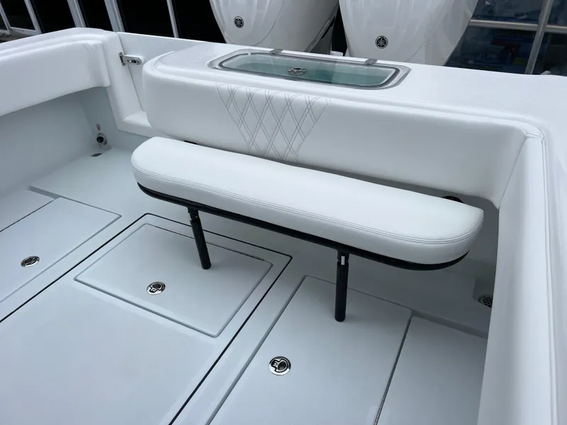 Slide: The Image of 2025 Contender 28S boat interior with white seating and storage compartments. - 15