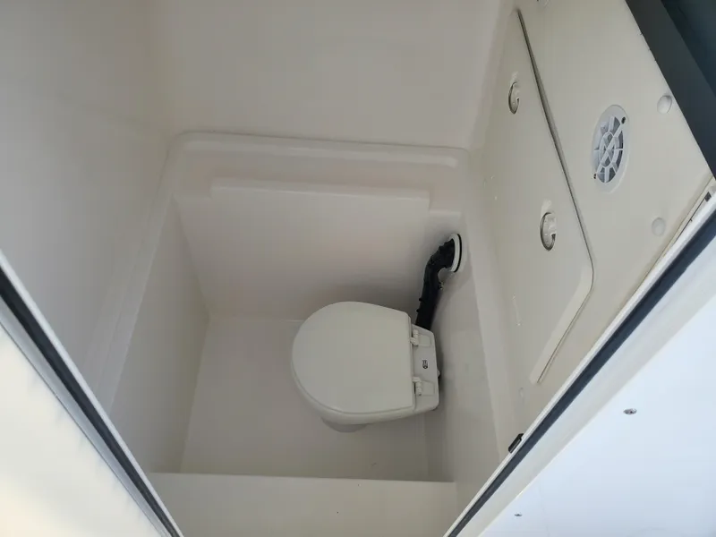 Slide: The Image of 2024 Contender 28S boat interior bathroom with toilet. - 18