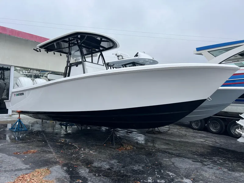 Slide: The Image of 2025 Contender 28S boat on display, featuring sleek design and modern structure. - 3
