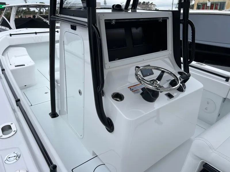 Slide: The Image of 2025 Contender 28S boat cockpit with steering wheel and control panel. - 8