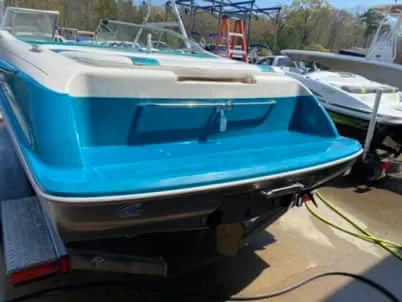 Slide: The Image of 1996 Maxum 2100SS Ski boat in blue and white, rear view. - 10