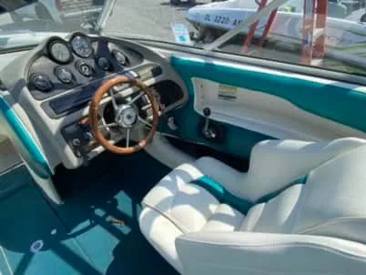 Slide: The Image of 1996 Maxum 2100SS Ski boat interior with steering wheel and dashboard. - 3