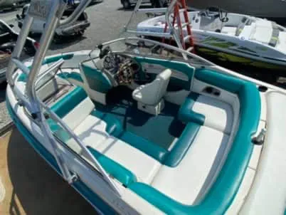 Slide: The Image of 1996 Maxum 2100SS Ski boat with teal and white interior. - 5