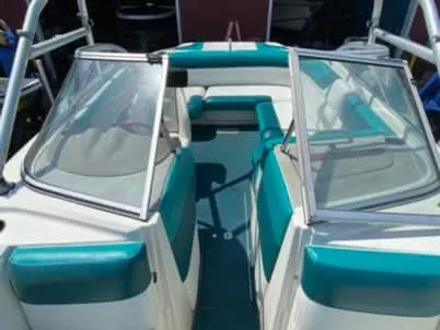 Slide: The Image of 1996 Maxum 2100SS Ski boat with teal and white interior. - 9