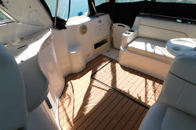 Slide: The Image of Interior of 2002 Rinker Fiesta Vee 310 boat with seating and wood flooring. - 27
