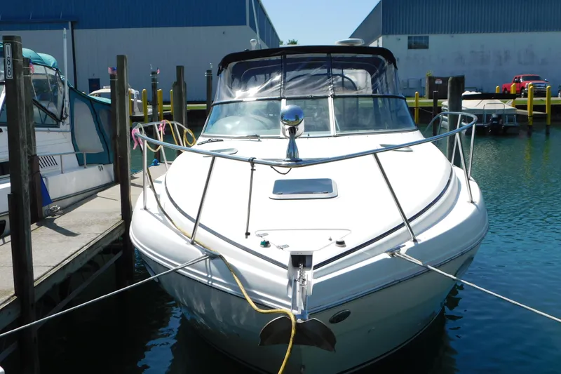 Slide: The Image of 2002 Rinker Fiesta Vee 310 boat docked in marina, front view. - 3