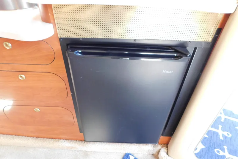Slide: The Image of Compact Haier fridge in 2002 Rinker Fiesta Vee 310 boat interior. - 47