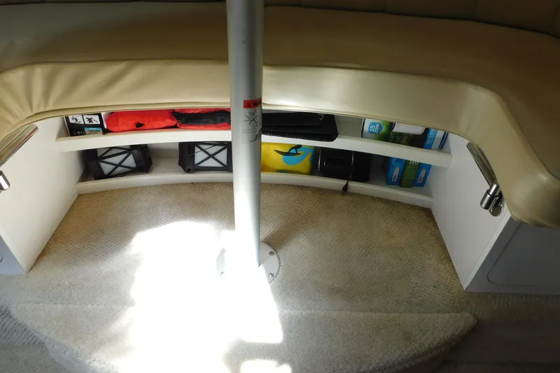 Slide: The Image of Interior storage area of 2002 Rinker Fiesta Vee 310 boat with various items. - 61
