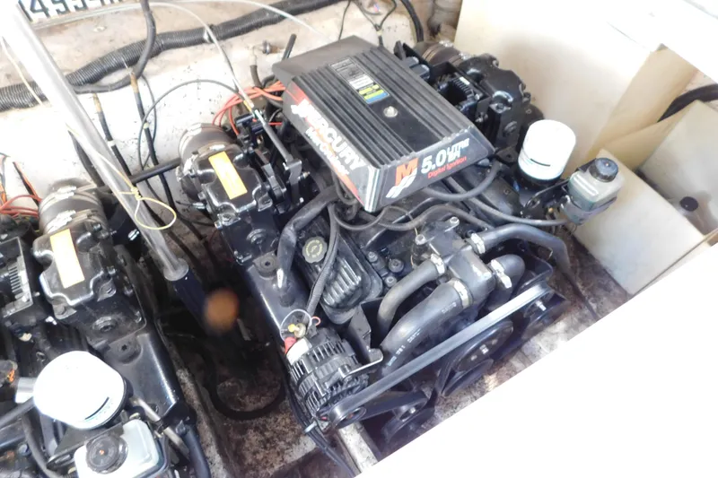 Slide: The Image of Engine compartment of a 2002 Rinker Fiesta Vee 310 with Mercury 5.0L engines. - 64